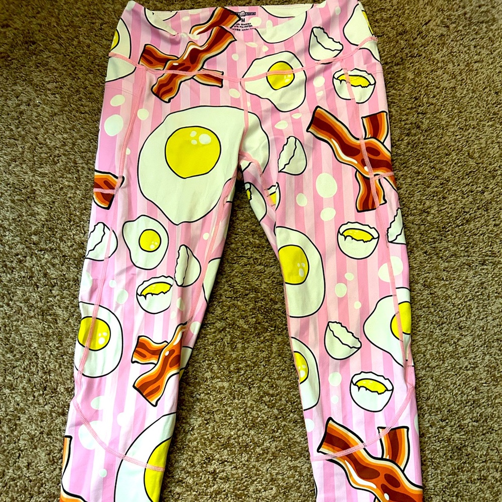 Feed Me Fight Me over easy leggings